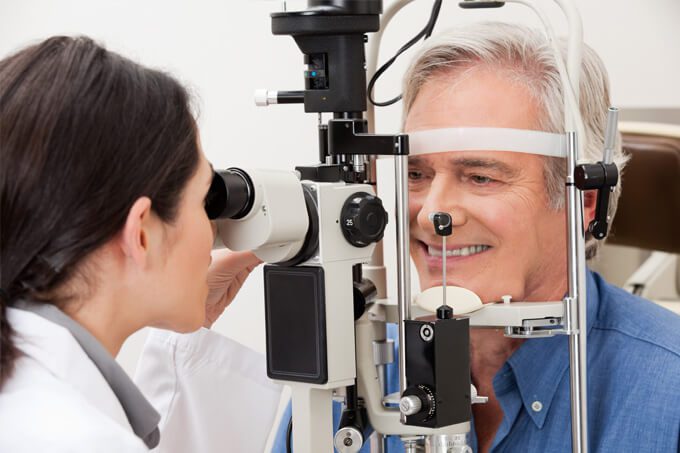 Old man in an eye exam